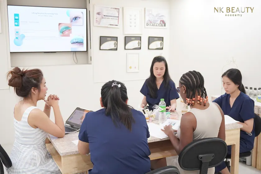 Students at the training benches during a class at NK Beauty Academy