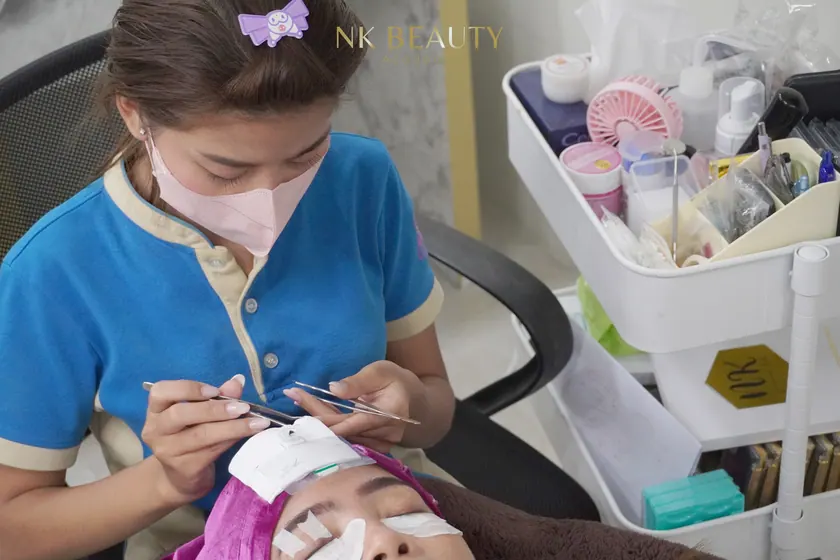 A student working on a live model during the hands-on part of the course