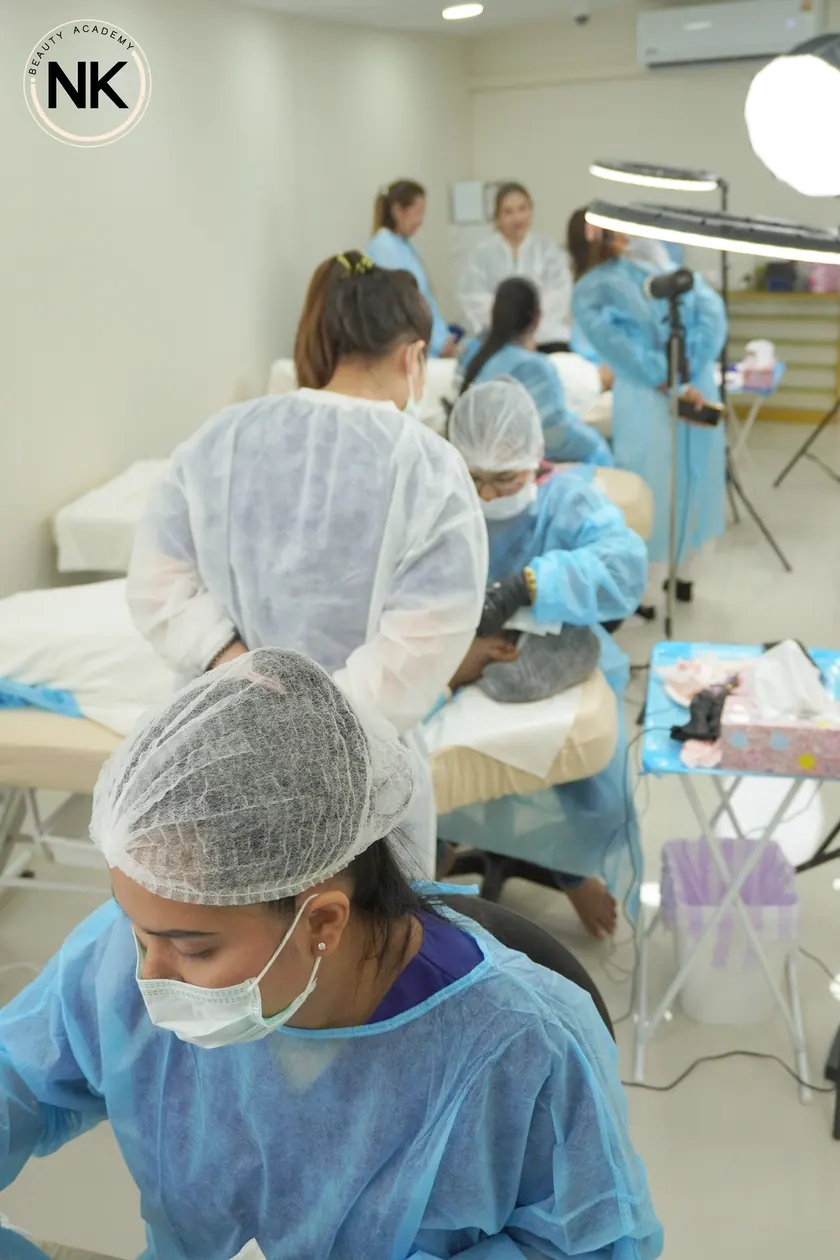 A student working on a live model during the hands-on part of the course