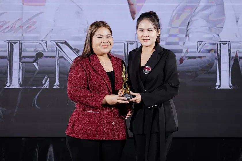 A trophy presented on stage at an industry competition
