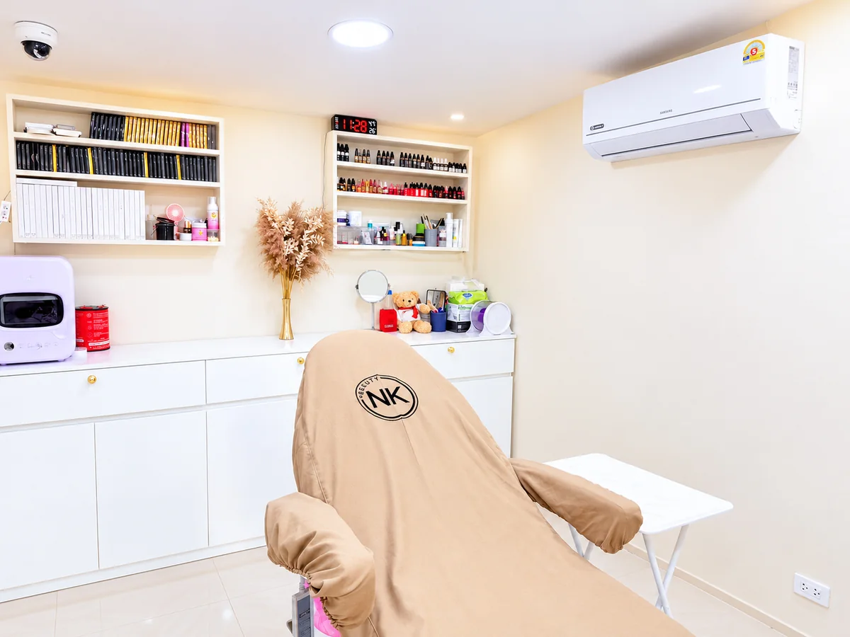 The permanent makeup room at NK Beauty Kathu, with the treatment bed and pigment shelves