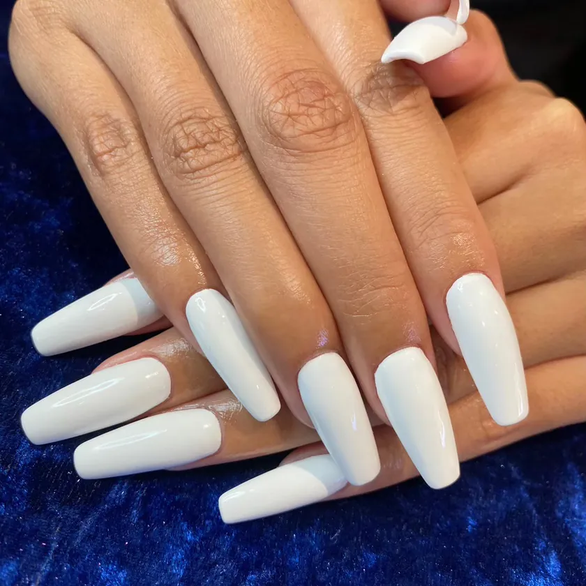 Nail work at NK Beauty: Long white coffin nails