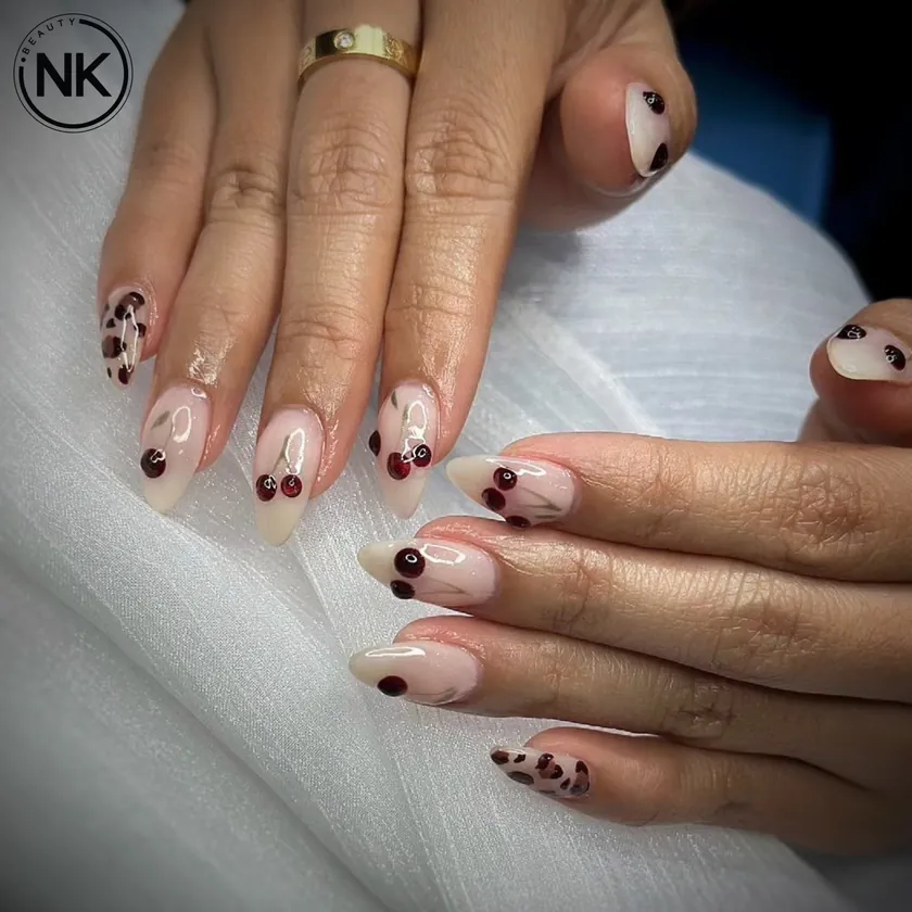 Nail work at NK Beauty: Nude nails with dot art