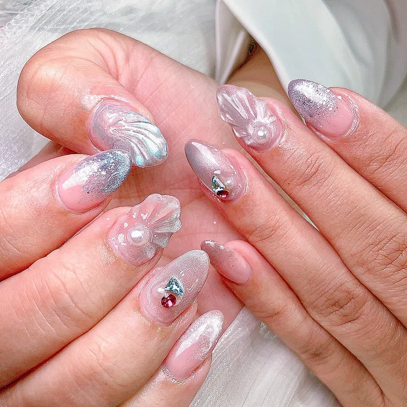 Nail work at NK Beauty: Clear nails with silver 3D art