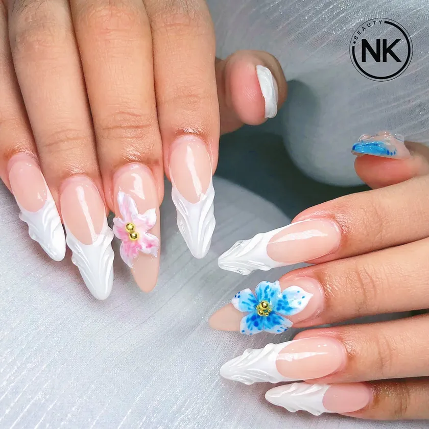 Nail work at NK Beauty: White French with a blue 3D flower