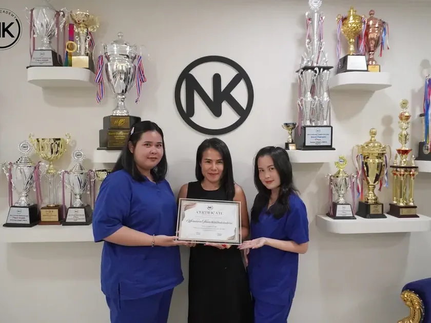 An NK Beauty Academy graduate with a course certificate