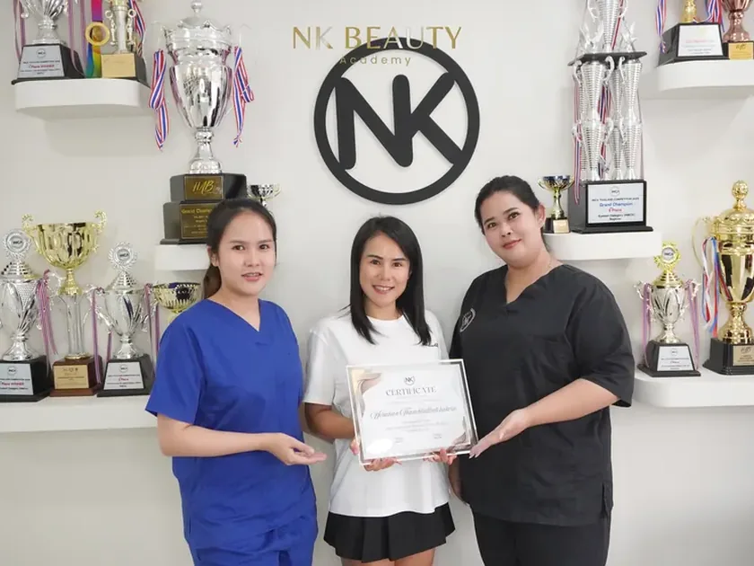 An NK Beauty Academy graduate with a course certificate