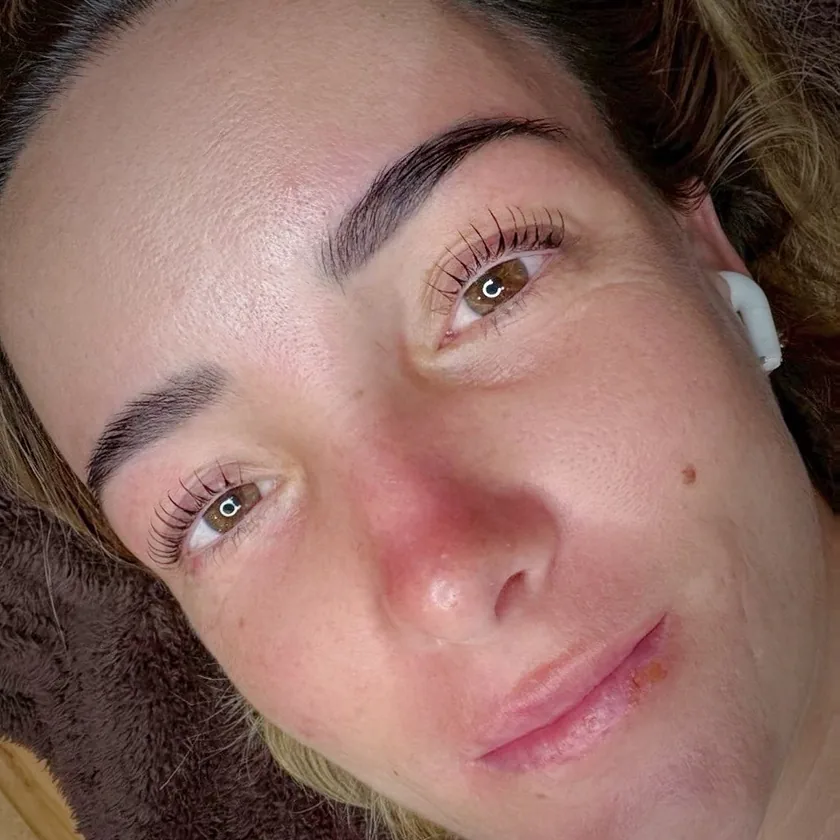 Lifted lashes on both eyes, photographed after the treatment